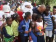 Haiti - Social : Laurent Lamothe distributes toys to children