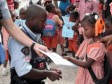 Haiti - Humanitarian : Santa Claus from Canada wears a blue helmet...